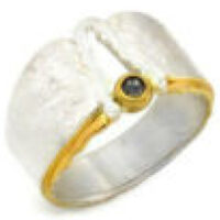 „Ring mit schwarzem Diamant und Teilvergoldung"